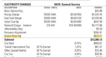 Example Xcel Energy industrial bill showing Interim Rate Adjustment line item for Minnesota customer.